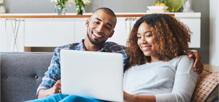 young couple working on laptop